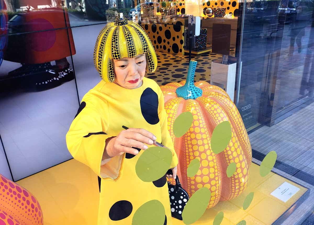 A realistic robot of Japanese artist Yayoi Kusama in the window of